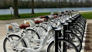 Row of white rental bikes available at Warsaw Adventures by Drake Harbor