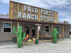 Front entrance of Palo Pinto Ranch Store in Lincoln, Missouri with western décor and colorful outdoor displays