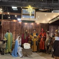 A live nativity scene is part of Cole Camp’s beloved German Christmas celebrations, honoring faith, heritage, and community tradition. Live nativity scene in Cole Camp, Missouri, featuring costumed participants, animals, and a glowing star during the town’s German Christmas events.